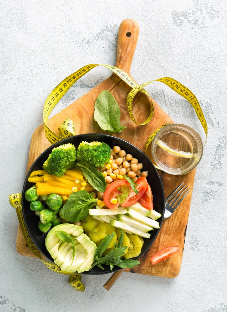 Healthy nutrition bowl of vegetables, avocado, and chickpeas at AfterBurns Fitness